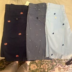 Three pairs of printed khakis